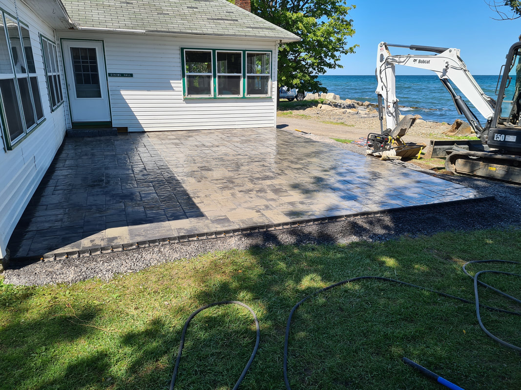 Lakefront paver patio install along Lake Ontario shoreline