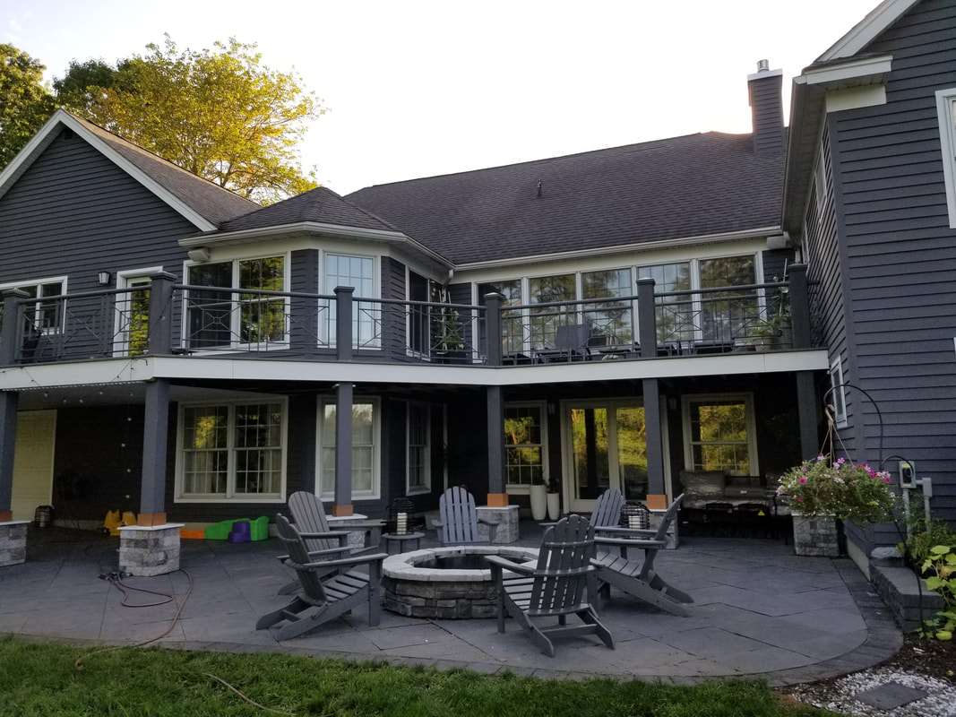Lakefront home with paver patio, stone firepit and second-story deck