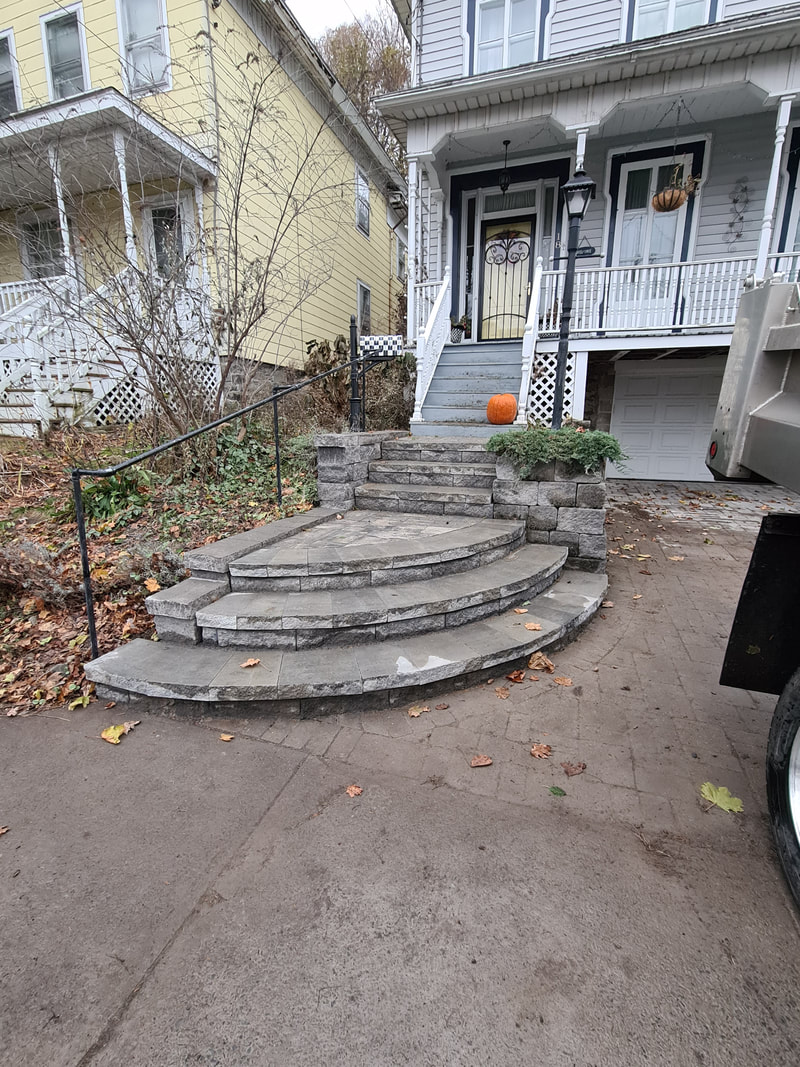 Curved stone front entry stairs in Pulaski, NY